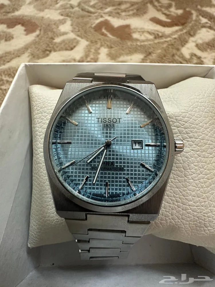 ساعة TISSOT كل شي موجود بالصور القفل سحاب لون المينا فيروزي